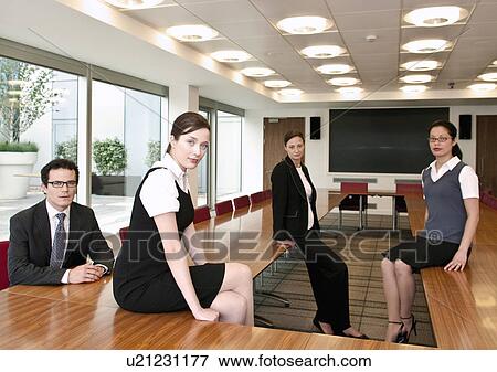 Stock Photo - Business team in boardroom. Fotosearch