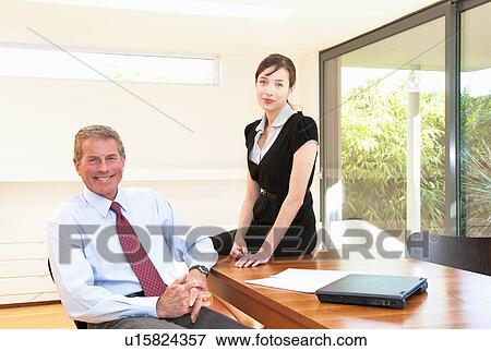 Business team in light office View Large Photo Image Stock Photo - Business team in light office. Fotosearch