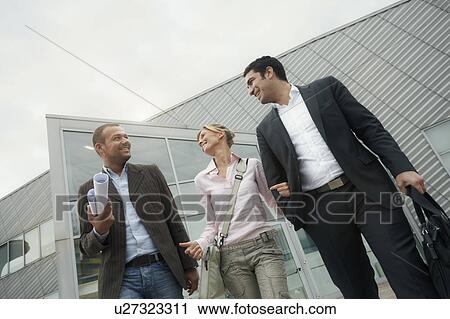 Business team walking outdoors View Large Photo Image Stock Image - Business team walking outdoors. Fotosearch