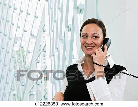 Business woman on phone View Large Photo Image Stock Image - Business woman on phone. Fotosearch
