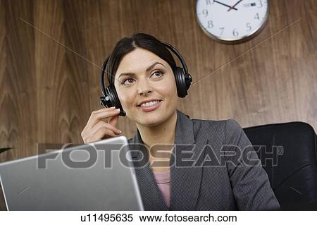 Business woman on telephone headset View Large Photo Image Stock Photography - Business woman on telephone headset. Fotosearch