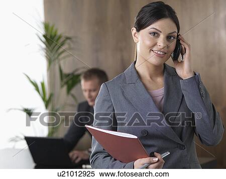 Stock Photography - Business woman on the phone. Fotosearch