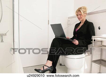 Business women works in bathroom View Large Photo Image Stock Image - Business women works in bathroom. Fotosearch