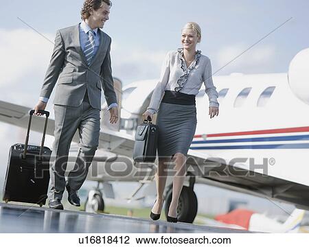 Businessman and businesswoman on the go View Large Photo Image Stock Image - Businessman and businesswoman on the go. Fotosearch