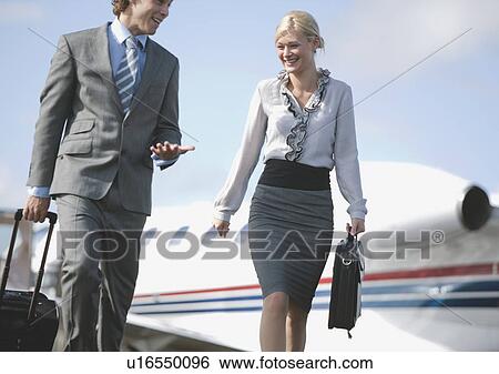 Businessman and Businesswoman on the mov View Large Photo Image Stock Photograph - Businessman and Businesswoman on the mov. Fotosearch