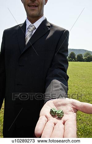 Businessman holding dice View Large Photo Image Stock Image - Businessman holding dice. Fotosearch