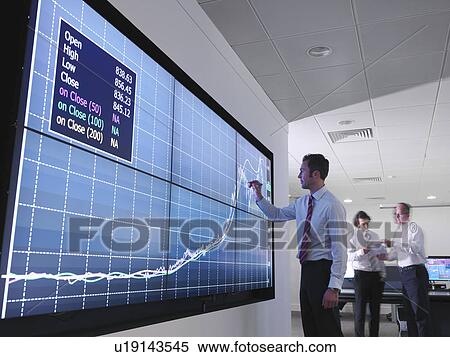 Businessman using graphs on screen View Large Photo Image Stock Photography - Businessman using graphs on screen. Fotosearch
