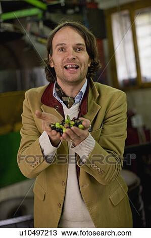 Businessman with olives View Large Photo Image Stock Image - Businessman with olives. Fotosearch