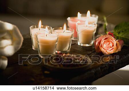 Picture - Candles and flowers. Fotosearch