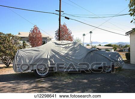 Car wrapped with car cover sheet View Large Photo Image Stock Image - Car wrapped with car cover sheet. Fotosearch