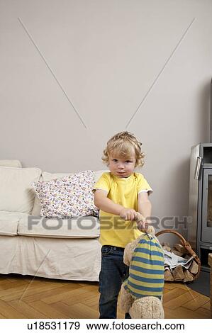 Child playing with toy View Large Photo Image Stock Photo - Child playing with toy. Fotosearch