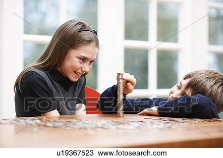 Children counting a pile of money View Large Photo Image Stock Image - Children counting a pile of money. Fotosearch