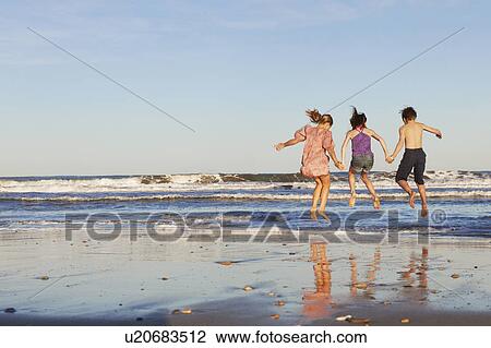 Children playing by the sea View Large Photo Image Stock Image - Children playing by the sea. Fotosearch