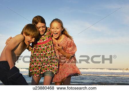 Children playing on the beach View Large Photo Image Stock Photo - Children playing on the beach. Fotosearch