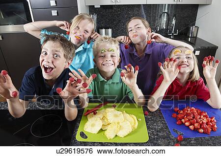Children playing with fruit View Large Photo Image Stock Photograph - Children playing with fruit. Fotosearch