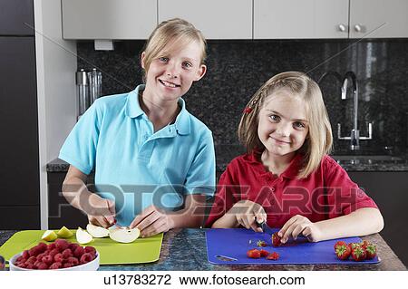 Stock Image - Children preparing food. Fotosearch