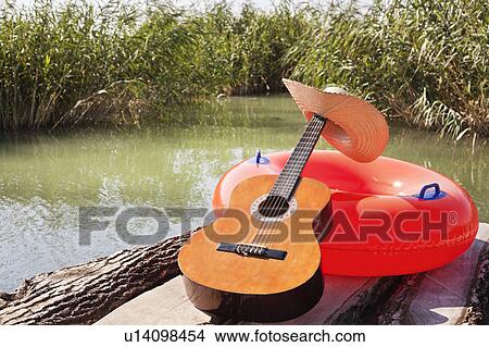 Chill out time by the lake View Large Photo Image Picture - Chill out time by the lake. Fotosearch