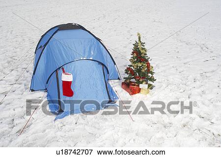 Christmas tree and tent in snow View Large Photo Image Stock Photo - Christmas tree and tent in snow. Fotosearch
