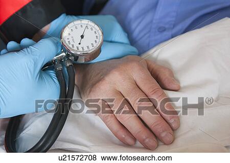 Close up; hands taking blood pressure View Large Photo Image Stock Photo - Close up; hands taking blood pressure. Fotosearch