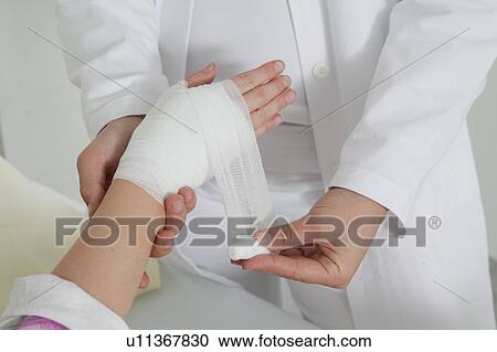Close up nurse applying a dressing View Large Photo Image Stock Image - Close up nurse applying a dressing. Fotosearch