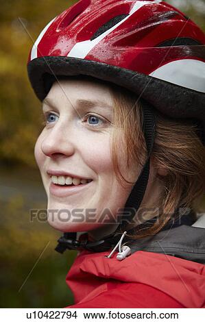 Picture - Close up of girl wearing cycle helmet. Fotosearch