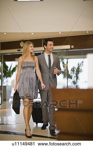 Couple arriving at hotel View Large Photo Image Stock Image - Couple arriving at hotel. Fotosearch
