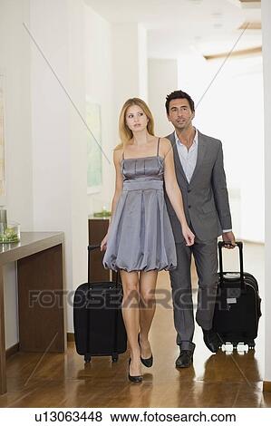 Couple arriving at hotel View Large Photo Image Stock Photo - Couple arriving at hotel. Fotosearch