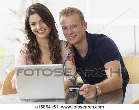 Couple at home shopping online View Large Photo Image Stock Image - Couple at home shopping online. Fotosearch