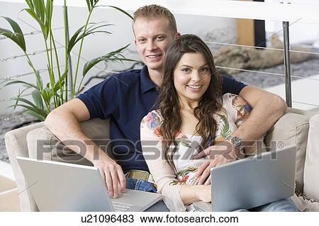 Couple at home shopping online View Large Photo Image Stock Image - Couple at home shopping online. Fotosearch