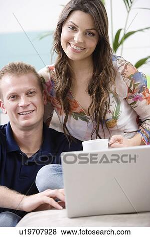 Couple at home shopping online View Large Photo Image Stock Photo - Couple at home shopping online. Fotosearch