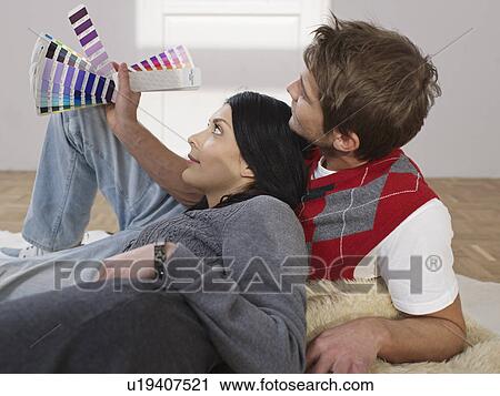 Couple choosing colors for new flat View Large Photo Image Stock Image - Couple choosing colors for new flat. Fotosearch