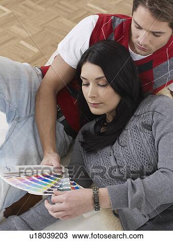 Couple choosing colours for decoration View Large Photo Image Stock Image - Couple choosing colours for decoration. Fotosearch