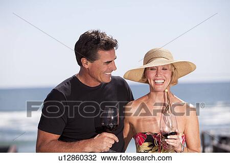 Stock Image - Couple drinking wine. Fotosearch