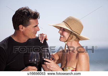 Couple drinking wine together View Large Photo Image Stock Image - Couple drinking wine together. Fotosearch