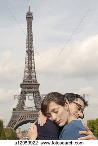 Couple embrace by Eiffel tower Paris View Large Photo Image Stock Image - Couple embrace by Eiffel tower Paris. Fotosearch