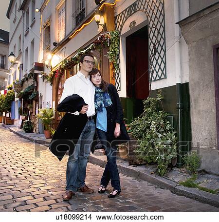 Picture - Couple embrace in monmartre in Paris. Fotosearch