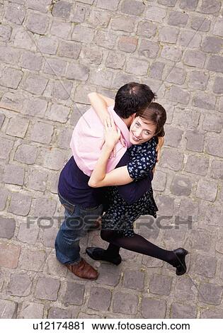 Stock Image - Couple embrace in Paris. Fotosearch
