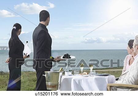 Couple enjoying the view View Large Photo Image Stock Photograph - Couple enjoying the view. Fotosearch