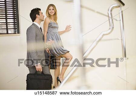 Couple going upstairs View Large Photo Image Stock Photo - Couple going upstairs. Fotosearch