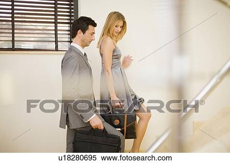 Couple going upstairs View Large Photo Image Stock Photography - Couple going upstairs. Fotosearch