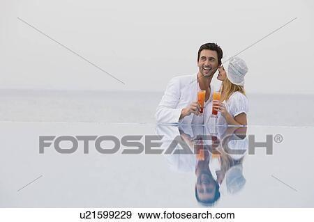 Couple having some drinks View Large Photo Image Stock Photo - Couple having some drinks. Fotosearch