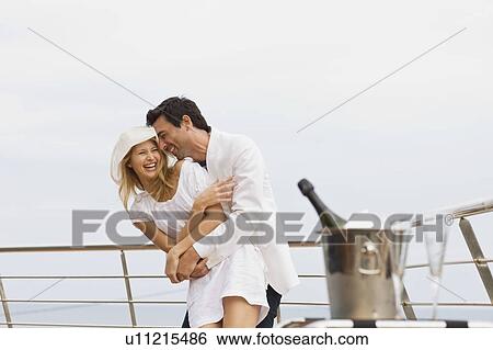 Stock Photograph - Couple hugging. Fotosearch