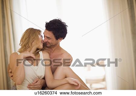 Picture - Couple in bed. Fotosearch