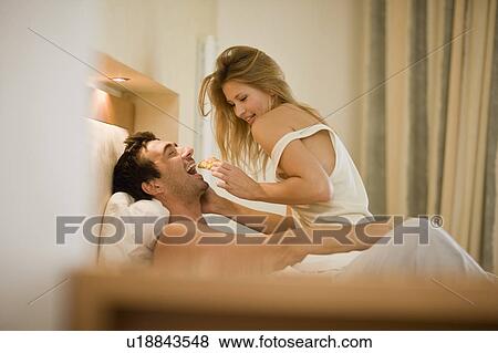 Stock Photo - Couple in bed. Fotosearch