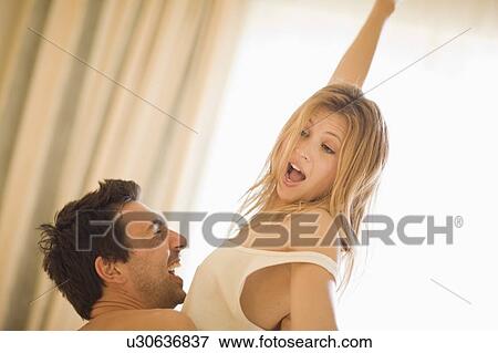 Stock Photo - Couple in bed. Fotosearch