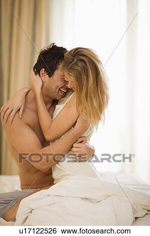 Stock Photograph - Couple in bed. Fotosearch