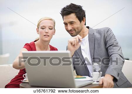 Couple in front of laptop View Large Photo Image Stock Image - Couple in front of laptop. Fotosearch