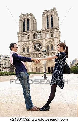 Stock Image - Couple in front of Notre Dame Paris. Fotosearch
