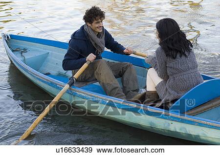Couple in rowing boat View Large Photo Image Stock Photo - Couple in rowing boat. Fotosearch