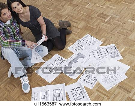 Couple in their living room View Large Photo Image Stock Photo - Couple in their living room. Fotosearch